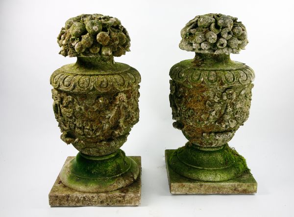 A pair of carved limestone finials