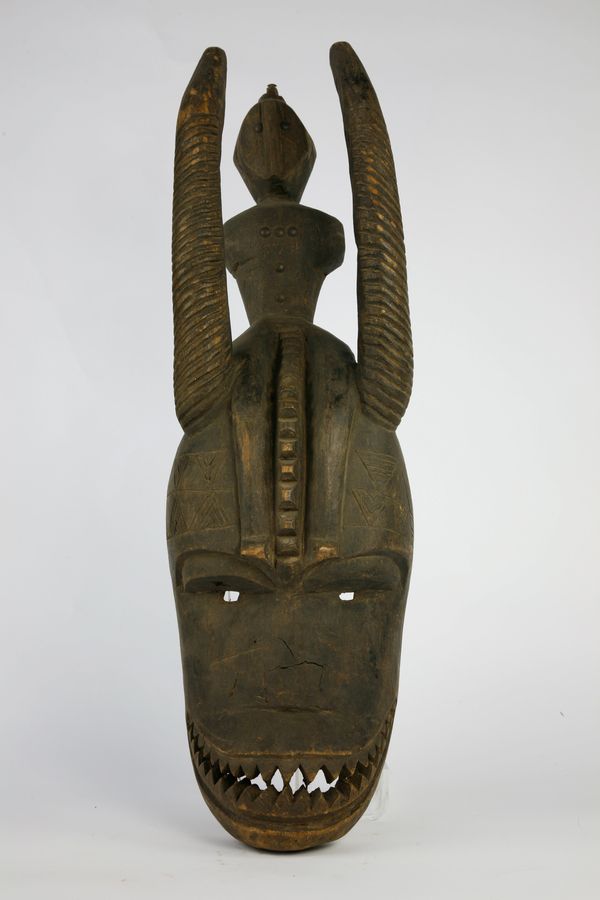 A carved wooden Tribal mask