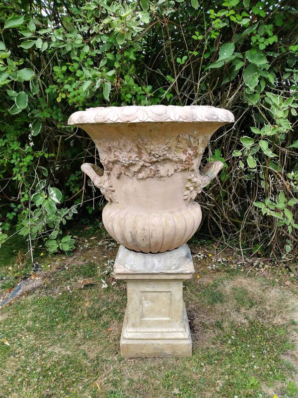 A terracotta urn on pedestal