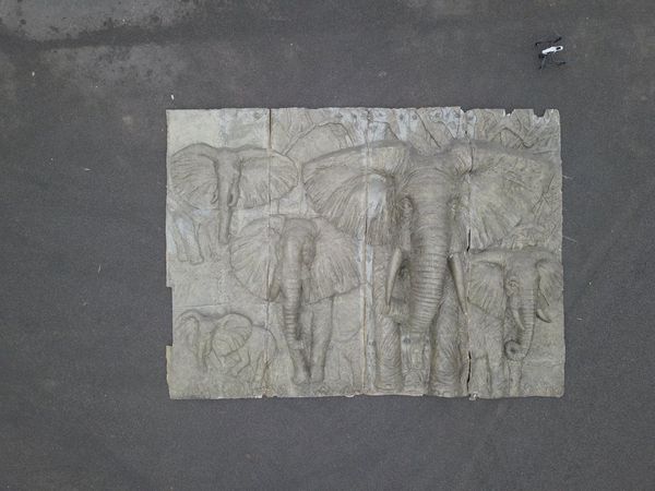 An impressive patinated fibreglass plaque modelled in high relief with elephants