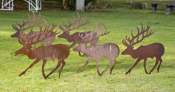 A set of five iron reindeer