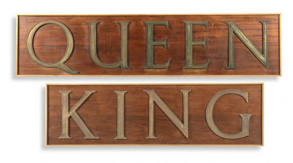 A  Queen sign with bronze letters