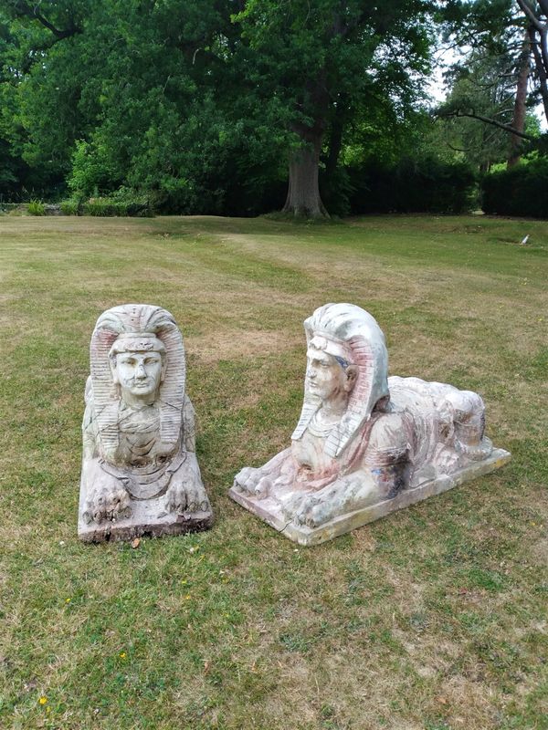 A pair of carved wooden sphinxes