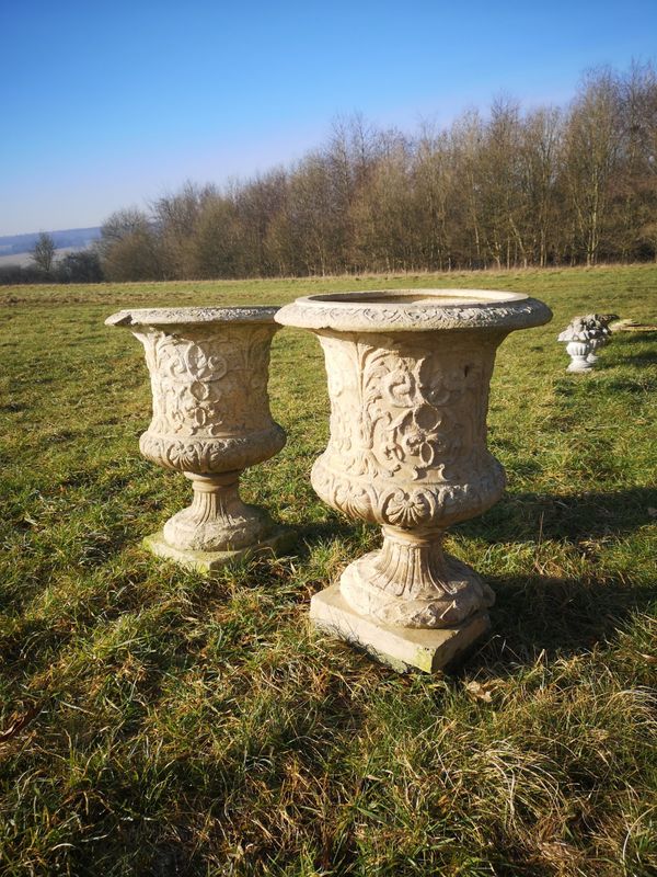 A pair of stoneware urns