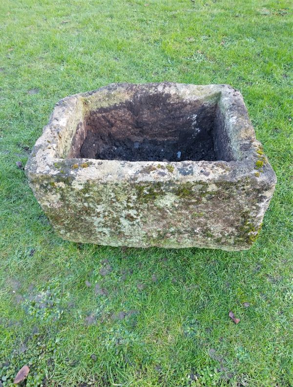 A  rectangular   carved cotswold stone trough
