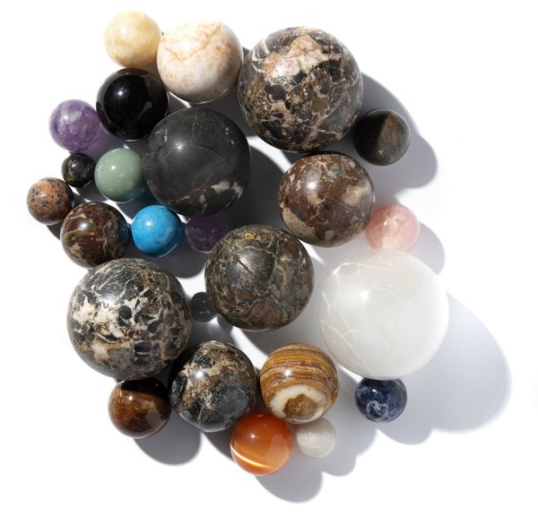A collection of 25 mineral spheres