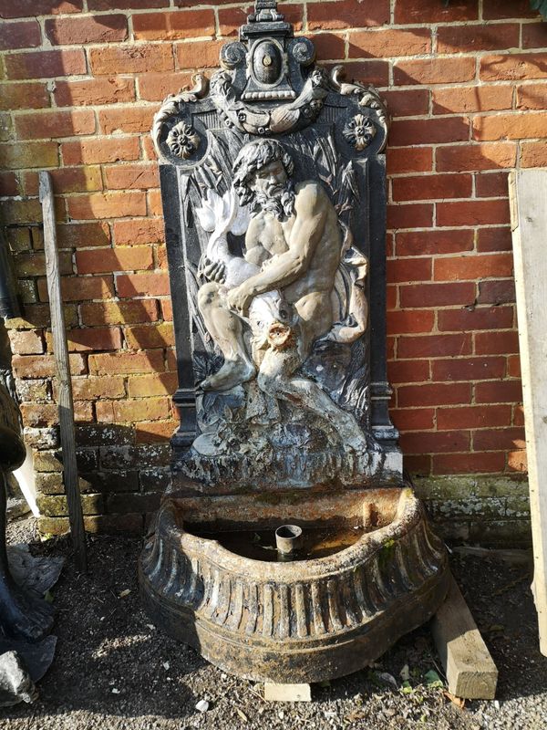 A cast-iron wall fountain