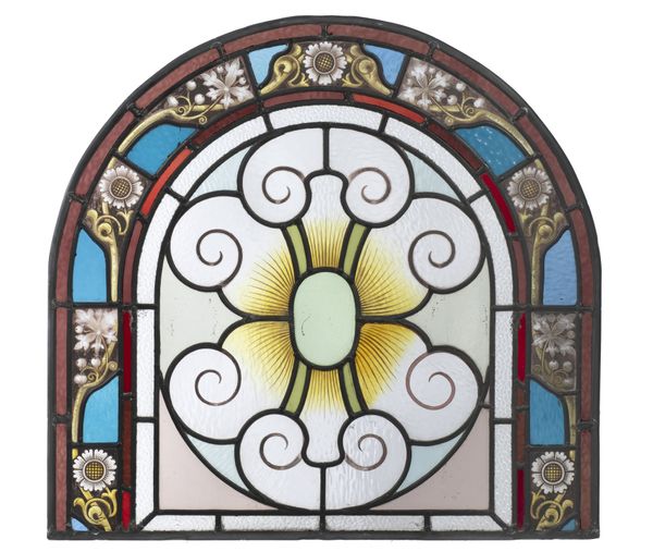 A stained glass arched panel