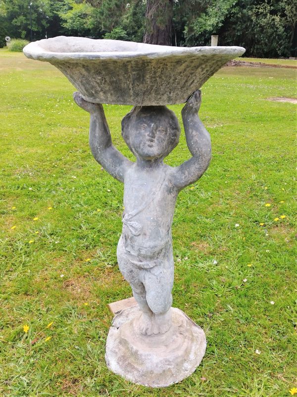 A lead bird bath