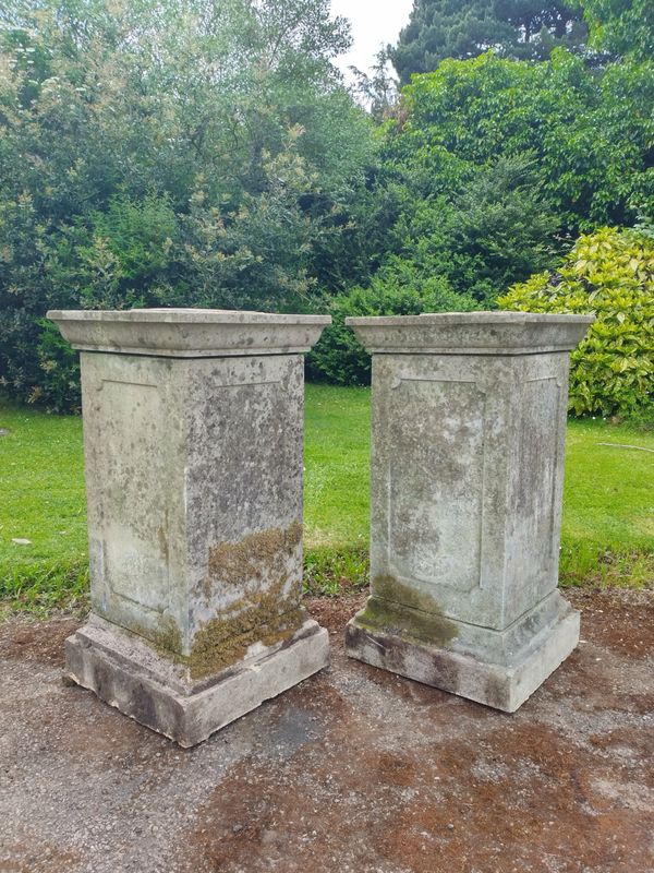 A pair of composition stone pedestals