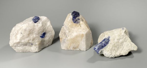 A group of three Lazurite in quartz specimens