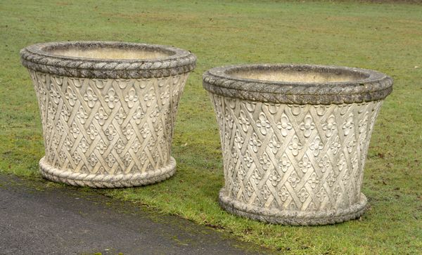 A pair of large composition stone planters