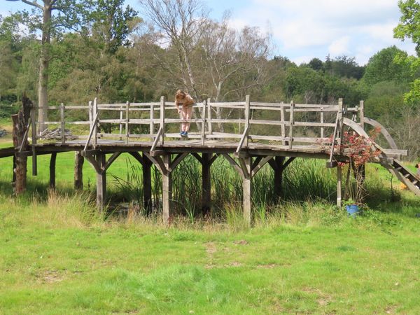 THE HISTORICALLY IMPORTANT POOH STICKS BRIDGE FROM ASHDOWN FOREST  A carved oak bridge circa 1907 with  restorations and reconstruction