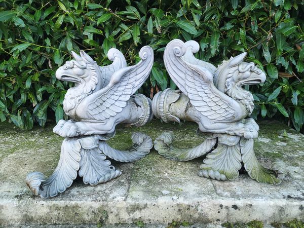 A pair of unusual cast iron Griffin terminals