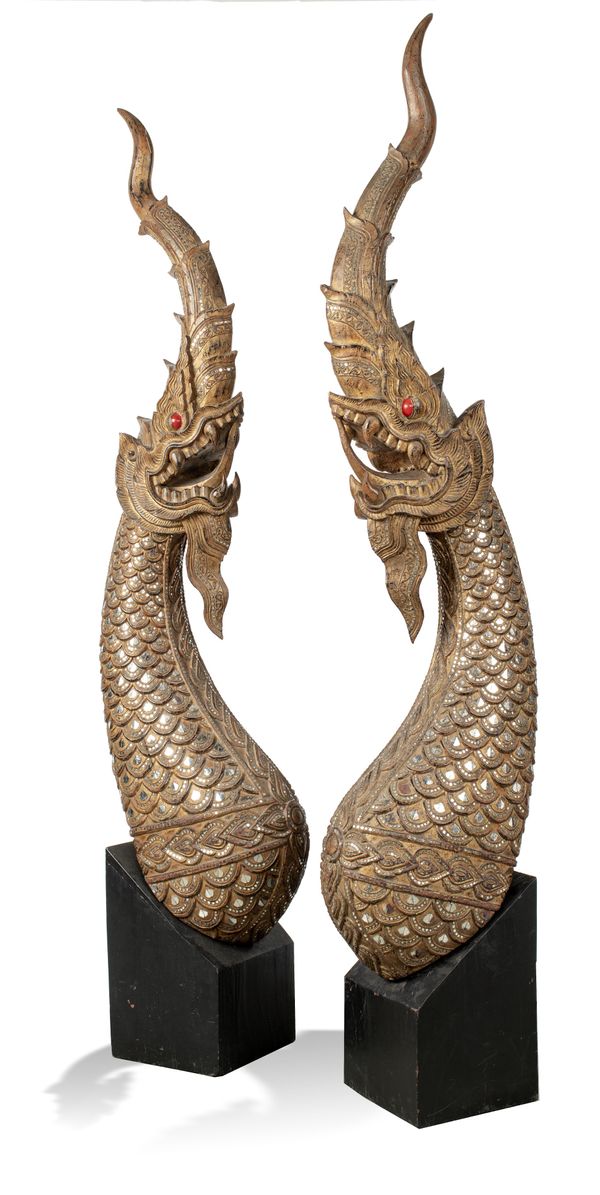 A pair of carved teakwood nagas