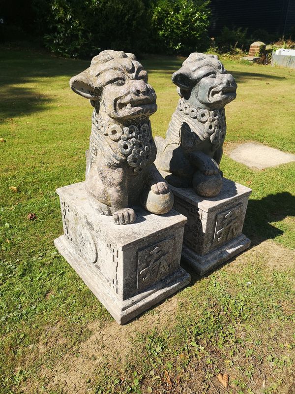 WITHDRAWN  A pair of composition stone dogs of Fo