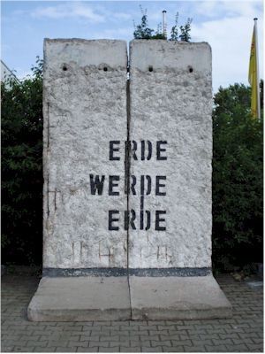 A similar smaller historically important portion of the Berlin Wall comprising two sections with stencilled graffiti by Ben Wagin ERDE...