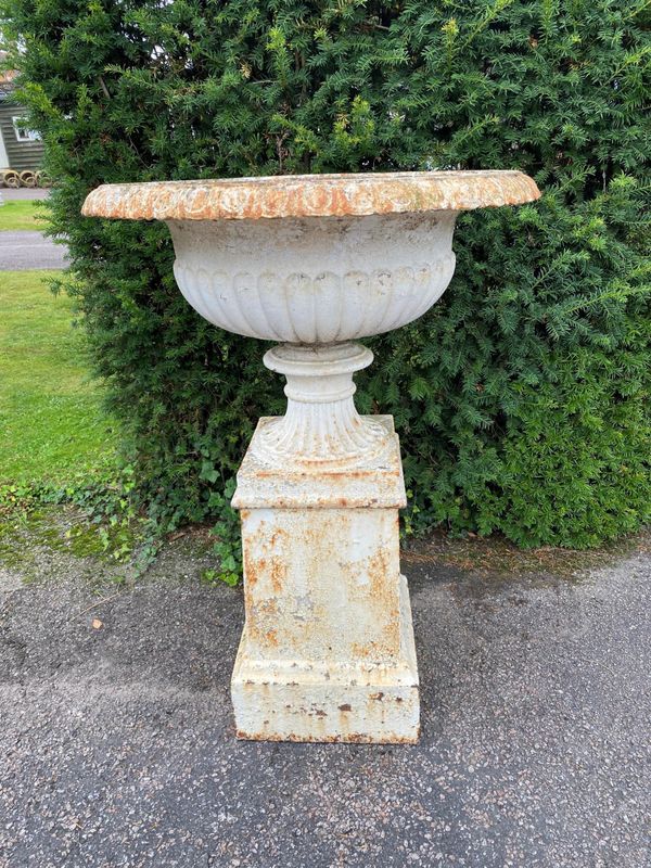 A Handyside foundry cast iron urn on pedestal
