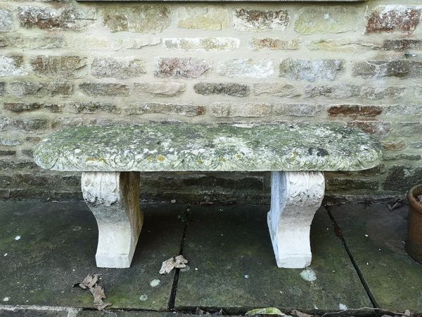 A carved Portland stone bench