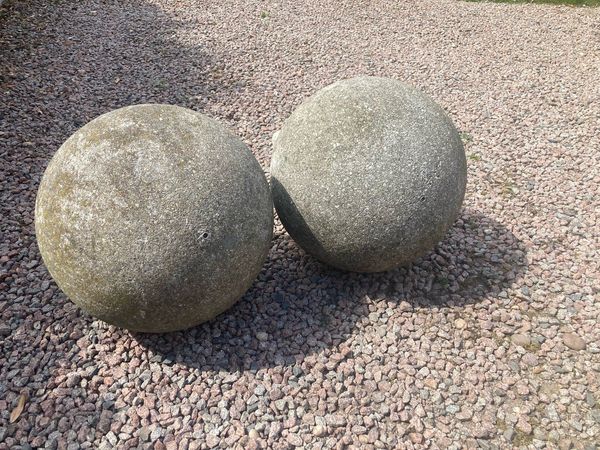 A pair of large composition stone balls