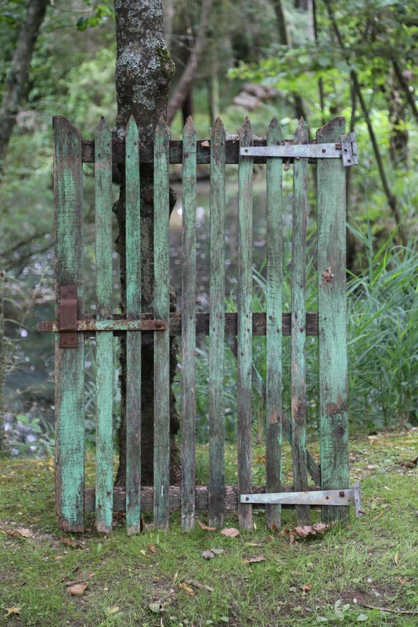 Two green painted wooden gates