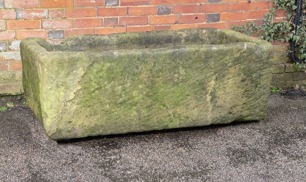 † A rectangular carved sandstone trough