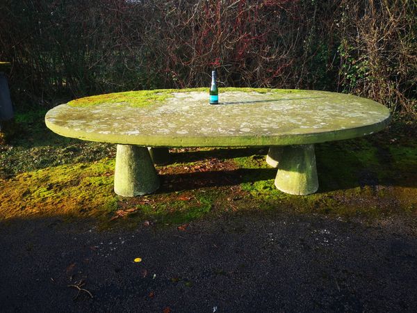 An extremely rare and massive carved sandstone oval table