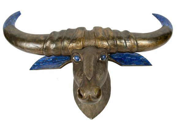 A similar gilded and carved hardwood buffalo head