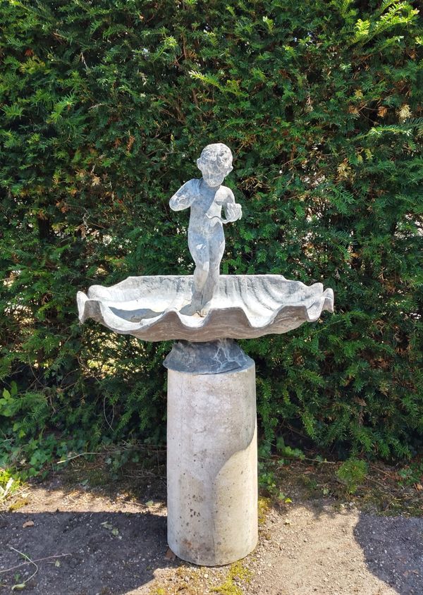 A lead and stone bird bath