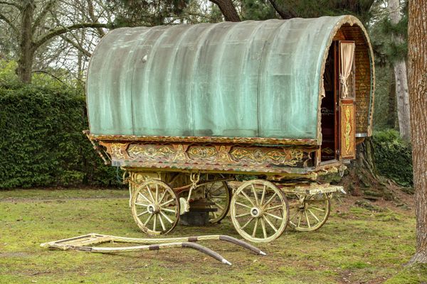 A bowtop Gypsy caravan  20th century the painted wooden frame with canvas top, hinged hayrack and double stable doors, the similarly painted...