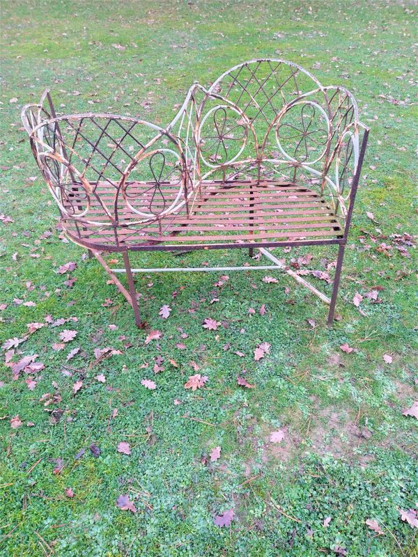 A wrought iron love seat