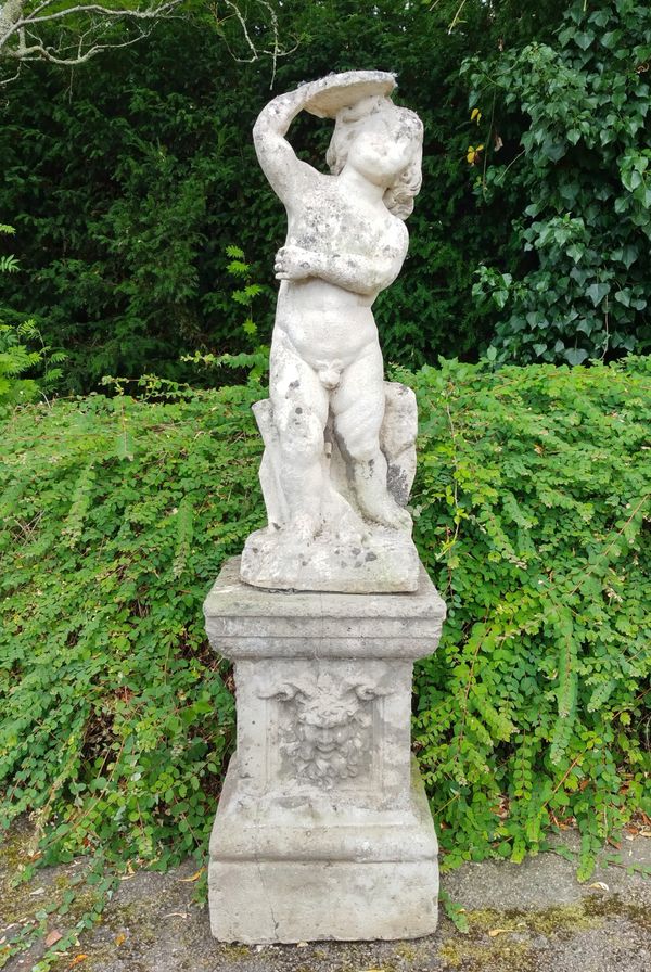 A carved stone figure of a putto on a composition stone pedestal