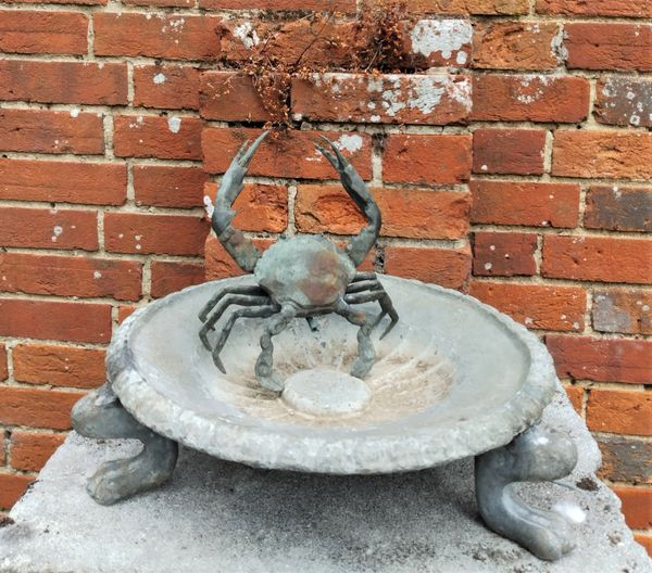 A lead bird bath