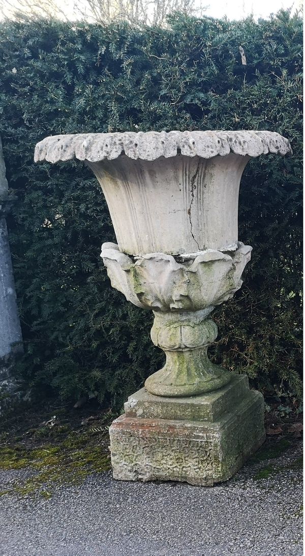 A composition stone urn - pedestal