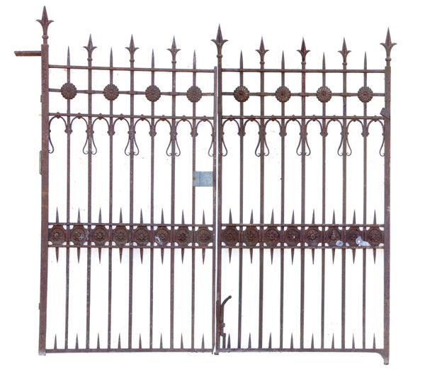 A pair of unusual wrought and cast iron bi-folding gates