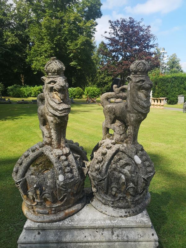 A pair of unusual composition stone armorial crowns