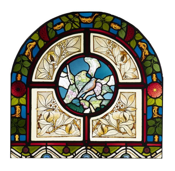 A leaded and stained glass arched rectangular panel