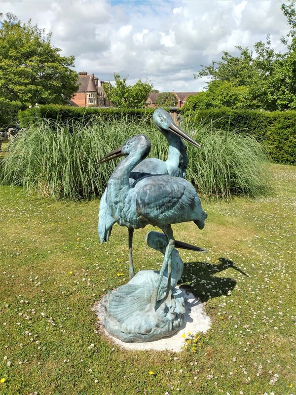 A bronze fountain group of three cranes