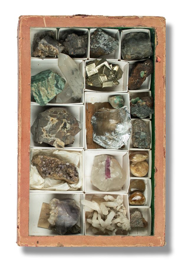 A collection of minerals in old display case