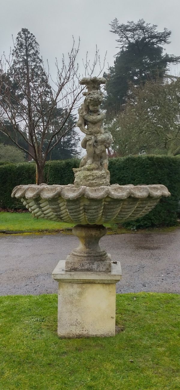 A composition  stone fountain on pedestal