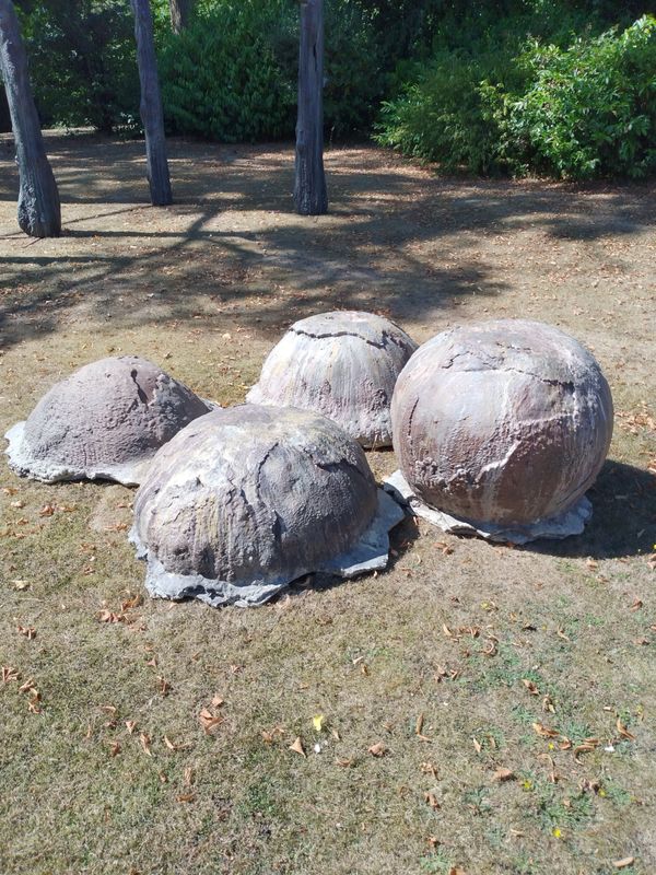 A similar set of four monumental resin dinosaur eggs