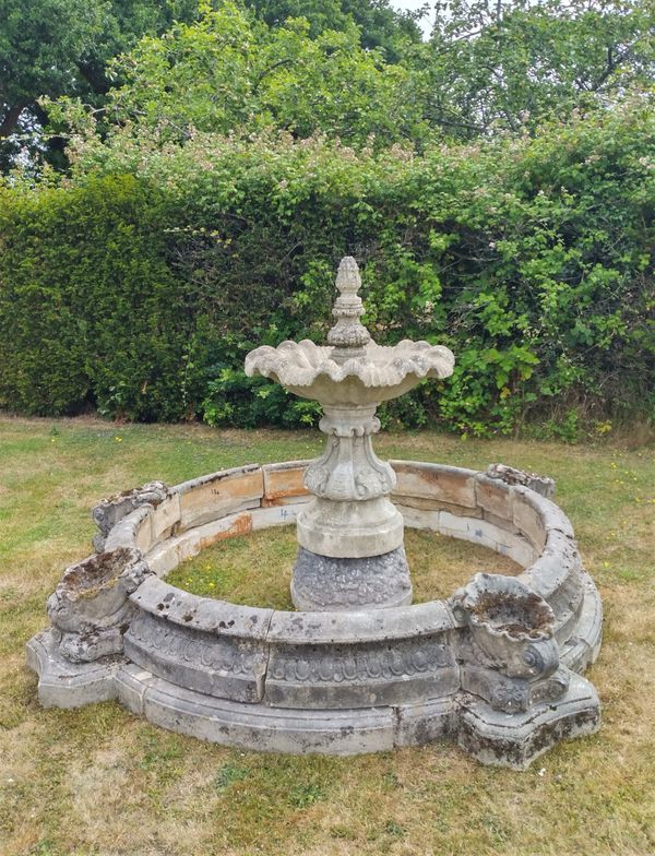 A composition stone fountain with surround