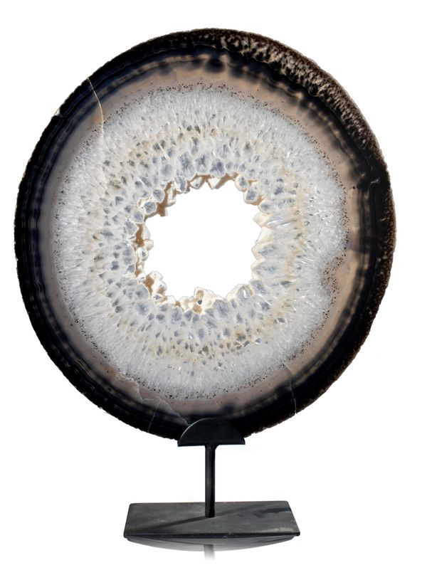 A large agate slice on metal stand