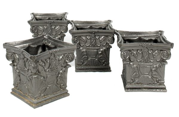 An unusual pair of painted cast iron square planters