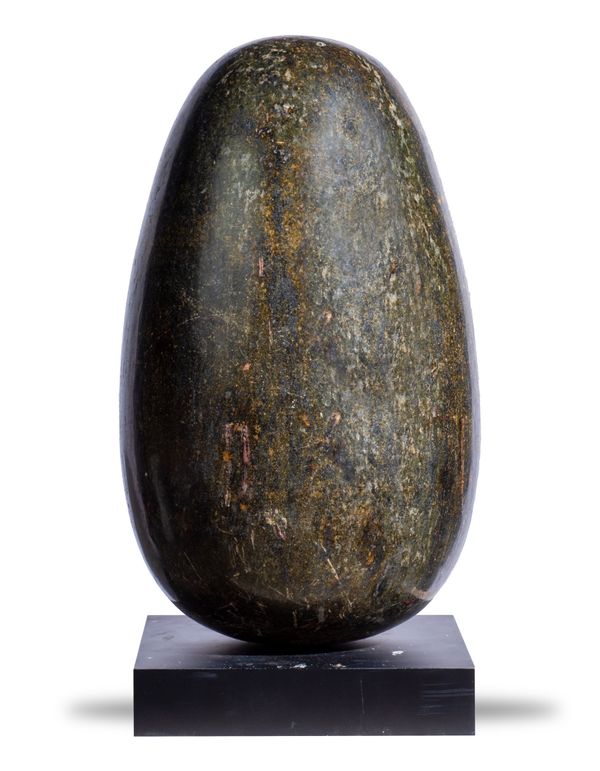 A large Lingam stone on stand