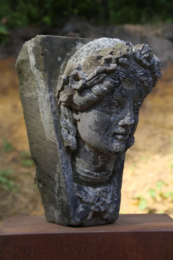 A Victorian carved sandstone keystone of a girls head