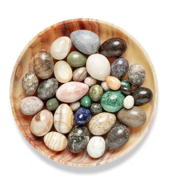 A collection of marble, onyx and mineral eggs