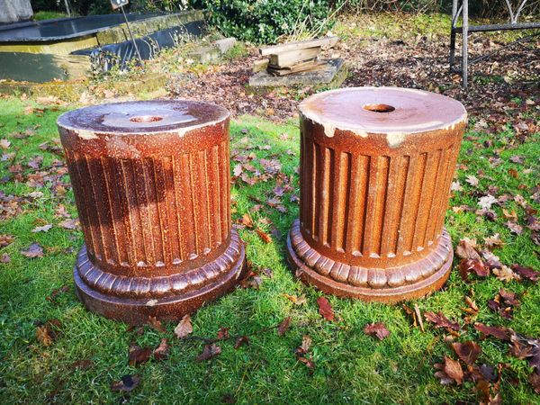 A pair of salt glazed earthenware fluted column pedestals