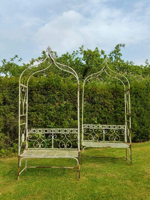 A similar wrought iron pergola seat