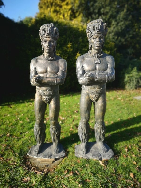Two similar patinated fibreglass figures of Zulu warriors